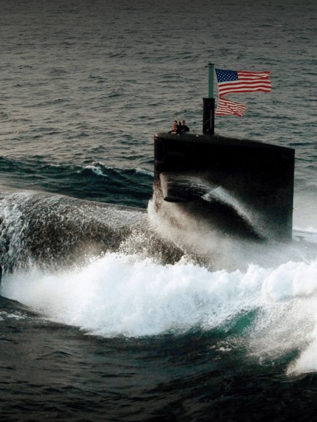 A submarine under way on the surface with the national ensign flying